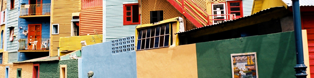 Brightly painted corrugated metal buildings in La Boca, Buenos Aires, Argentina. Featured on the Best of Argentina and Chile tour.