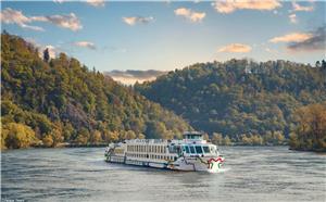 Danube River Cruise Boat Surrounded by Scenic Nature